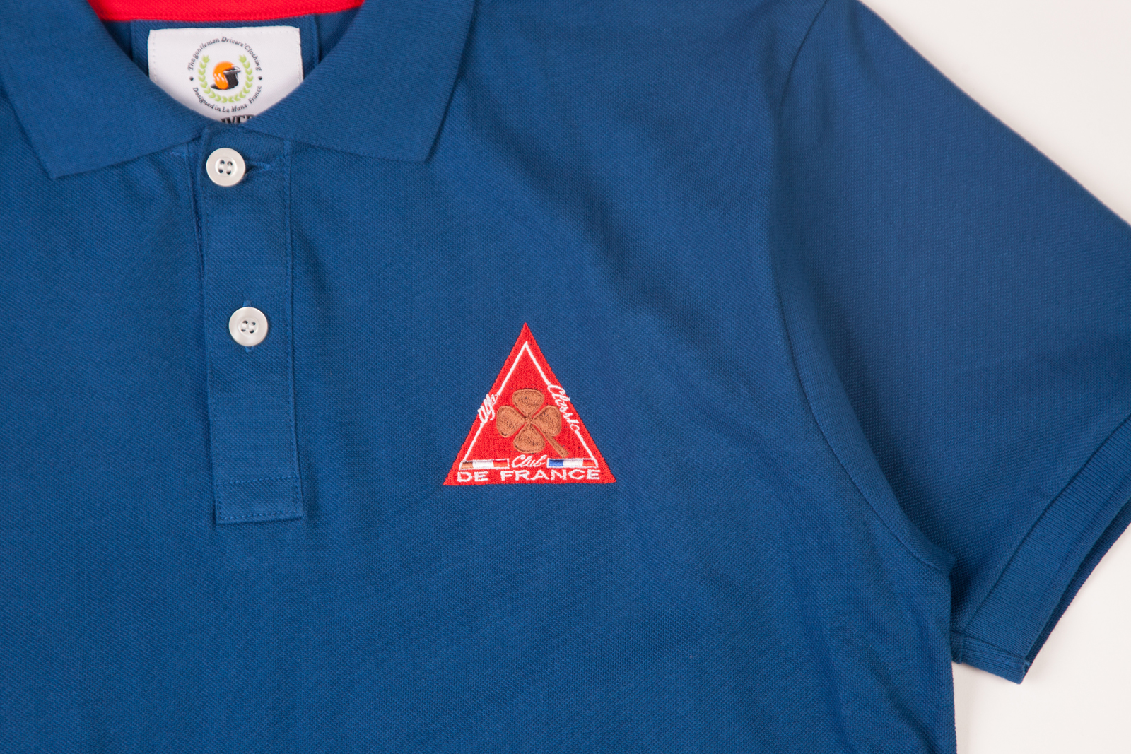 blue-polo-shirt-multiple-embroidery-details